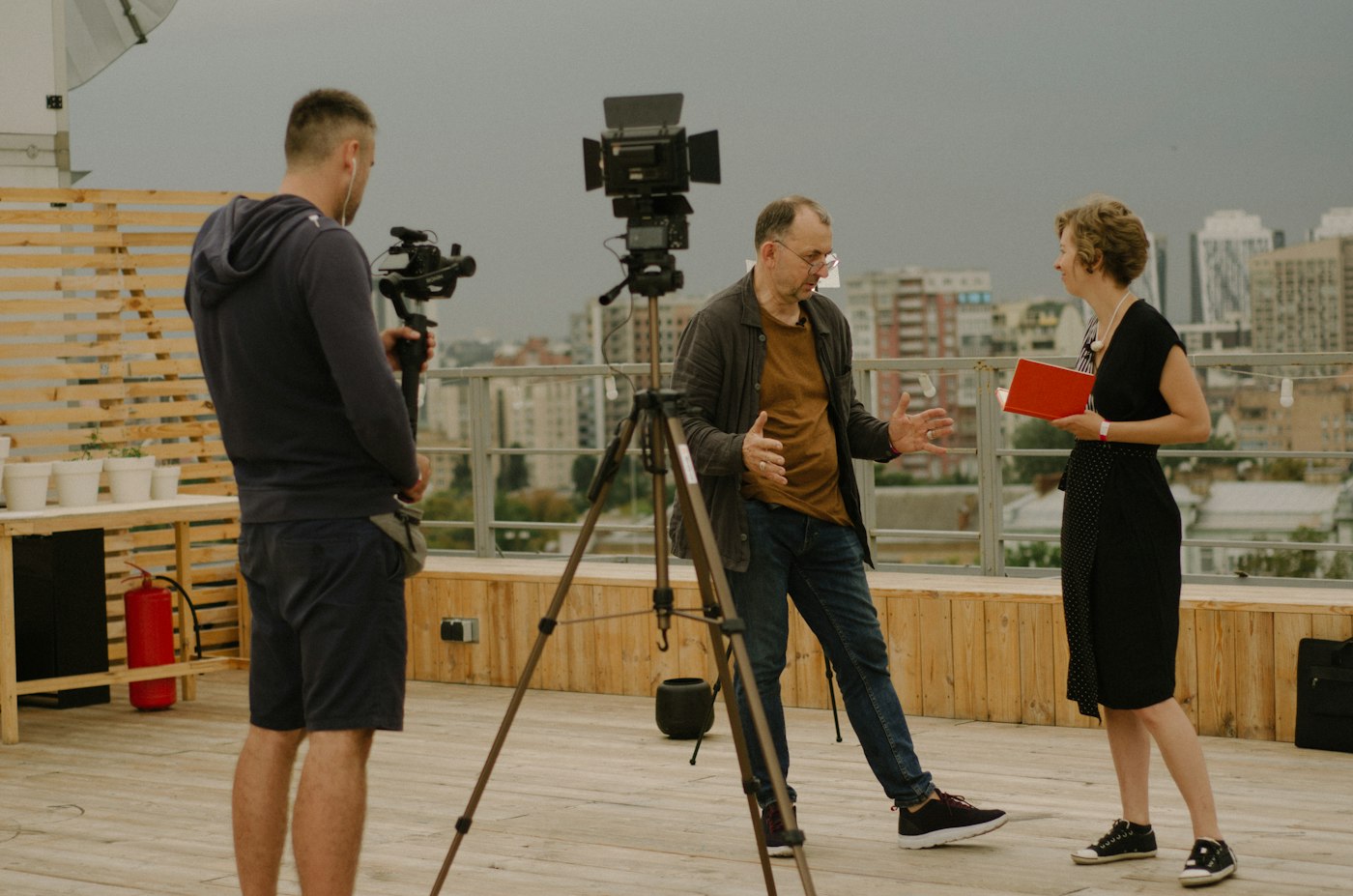 Broadcast or media production environment with cameras and talent.
