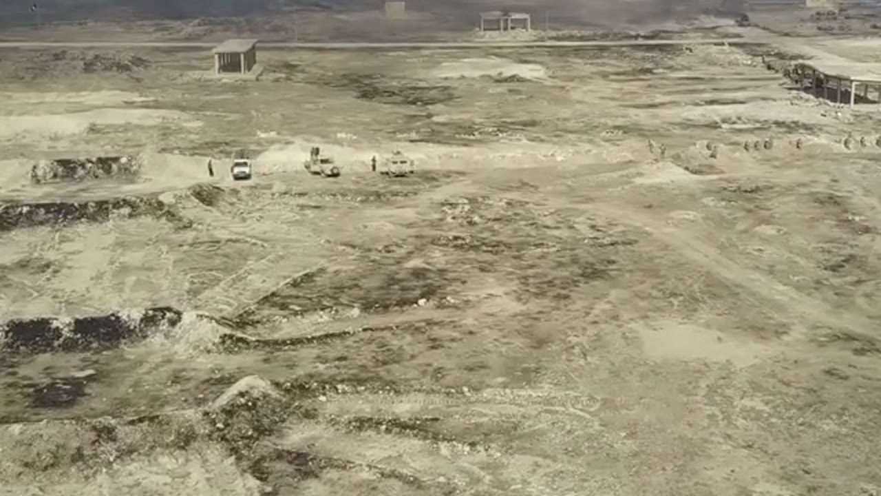 Field operations video showing vehicles and terrain from an elevated viewpoint.