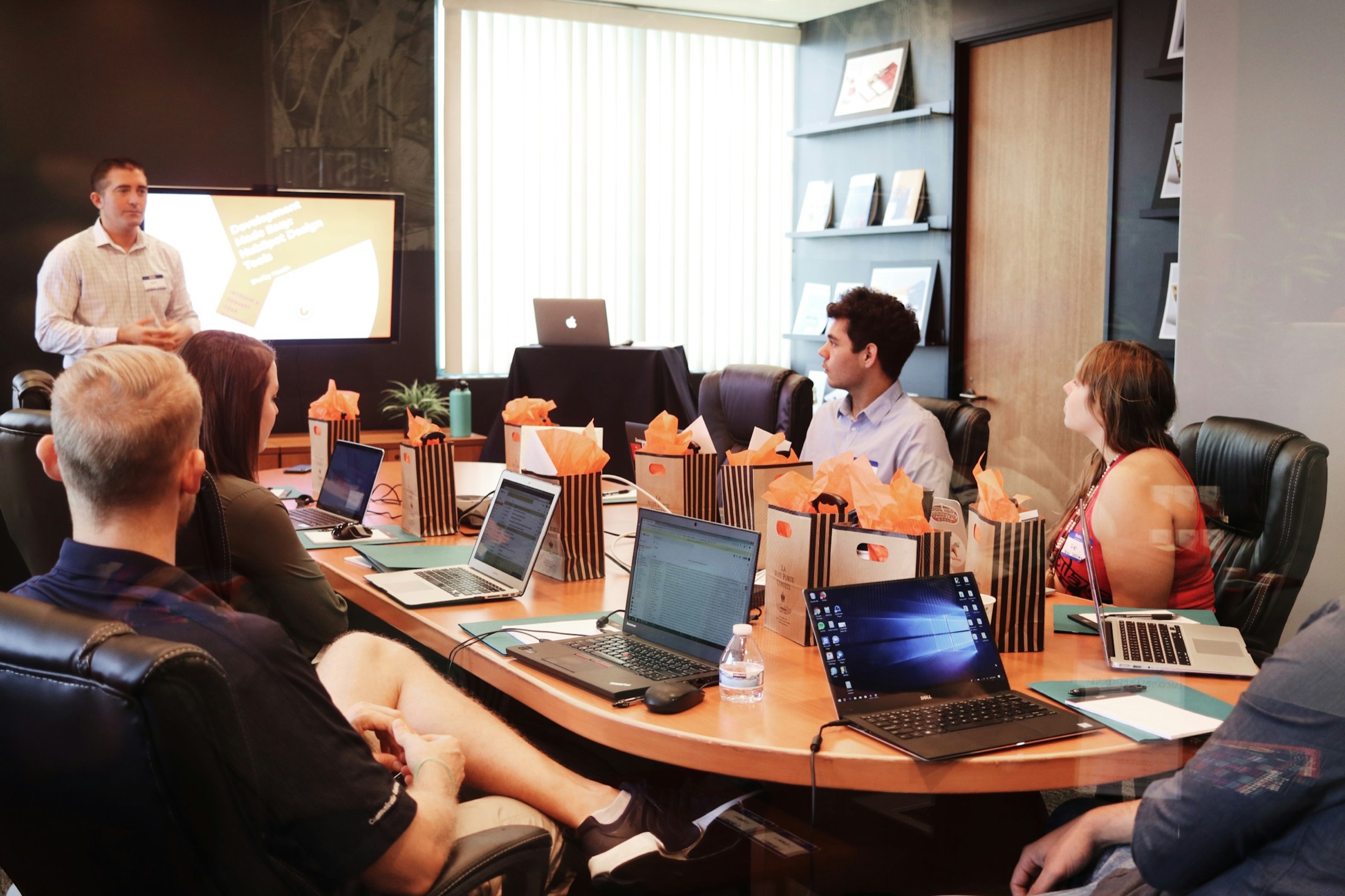 SaaS enablement session with a presenter walking a team through product training.